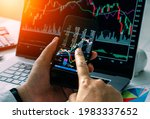 Businessman checking stock market by his smartphone and labtop.Trade and finance concept