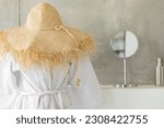 Home cozy room interior with straw hat, bathrobe and mirror. Home entertainment concept.