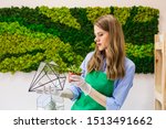 Girl plants a plant in a glass vase, planting succulents, florist and product for the interior, a picture of moss