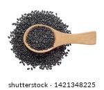 Black sesame seeds in wooden spoon pile and spread isolated on white background.Scientific name is Sesamum orientale L.Herb.cereal, Top view.