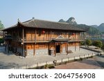 Small photo of 3 April 2018 Hunan Fenghuang (Phoenix) Ancient Town, China : A boat taking tourists rolling along the Tuojiang River in Fenghuang village which was added to the UNESCO World Heritage Tentative List