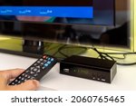 Digital decoder for new television transmission with remote control and television monitor.