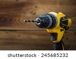 Electric Drill On A Wooden...