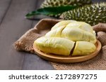 Small photo of Long Laplae Durian on wood plate,It is the most expensive and most delicious of all durians. Rare durian in Thailand