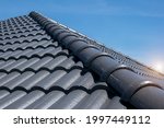 concept for roof housetop icon with grey roofing tiles. banner texture for roofers