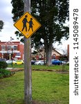 Small photo of Oakleigh, VIC / Australia - July 26 2018: Yellow road sign advising drivers to exercise caution in busy pedestrian areas