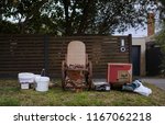 Small photo of Oakleigh, VIC / Australia - Aug 27 2018: chair and miscellaneous hard rubbish put on curbside for council annual collection