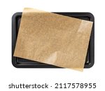 Baking sheet with brown parchment paper isolated on a white background. Empty oven tray for baking and roasting. Rectangular baking pan for food design. Nonstick kitchen utensils. Top view.