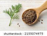Raw Dill Seeds In A Wooden...