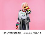 Small photo of Happy and funny cool old lady with fashionable clothes portrait on colored background - Youthful grandmother with extravagant style, concepts about lifestyle, seniority and elderly people