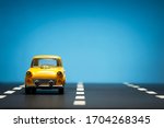 front view of a yellow toy car... | Shutterstock . vector #1704268345