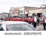 Small photo of Derry, New Hampshire, USA - November 27, 2021: Annual Nutfield Holiday Parade, Pinkerton Academy high school marching band in downtown Derry