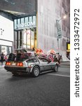 Small photo of New York, NY / USA - September 16 2018: DeLorean DMC-12 on the street. Viacom office on the background