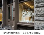 Broken store window by vandals