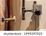 Focus on heating controls of a hot water heater with base plate on