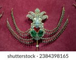 Small photo of Istanbul, Turkey, 11th of October 2023, A brooch with ruby and emerald stones of Treasure room ( Turkish, hazine odasi) at Topkapi Palace Museum, Editorial only.