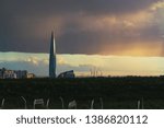 Small photo of huge thundercloud on the outskirts of the city before the rain - image