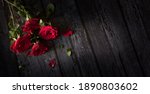 Red Roses On Wooden Background