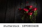 Red Roses On Wooden Background