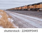 Small photo of Gillette, Wyoming - January 23, 2021: Hundreds of train engines being stored on train tracks near GIllette, Wyoming on a cold winter day.