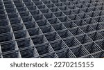 Small photo of Wire mesh piles for construction. BRC welded steel wire mesh for concrete slab reinforcement of construction construction site in top view with natural light and selective focus.