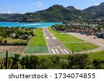 Small photo of Elevated view down St Barth's Gustaf III Airport short runway, which is one of the world's most difficult airports to land at, to St Jean bay and mountains, St Barts, French Caribbean 12.02.19