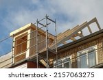 dormer installation on the rooftop of a apartment house