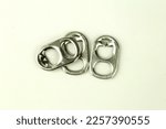 Small pop tabs of drink can on white background