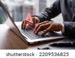 Small photo of Businessman using computer laptop with caution warning sing for notification error and virus detection spyware, Internet network security concept