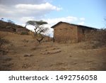 Small photo of ETHIOPIA - MARCH 2014: Ethiopian house placed in a desert and sandy place with exiguous vegetation
