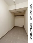 Small photo of MODERN PANTRY IS STOREROOM ON GROUND FLOOR IN MODERN RESIDENTIAL BUILDING. Bomb shelter (shelter, bombproof shelter, bombshelter, air-raid shelter).