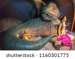 Small photo of London, UK - December 2015: Madame Tussaud’s Waxwork Museum, Star Wars display, Princess Leia, Jabba the Hutt and Salacious Crumb, life size models