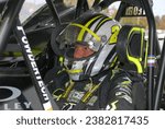 Small photo of Middletown, NY, USA - October 23, 2022: Race driver Brett Hearn prepares to compete in the Eastern States 200 Dirt Modified stock car race at New York's Orange County Fair Speedway.