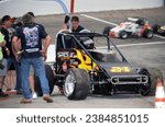 Small photo of Anderson, IN, USA - May 26, 2018: Race driver Jo Jo Helberg makes a pit stop during the Little 500 Sprint Car race at Anderson Speedway in Indiana.