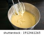 Small photo of Closeup of Stand Mixer Beaters in Above Vanilla Cake Batter: Cake batter that has been mixed in an electric stand mixer bowl