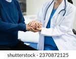 Small photo of Female doctors shake hands with patients encouraging each other To offer love, concern, and encouragement while checking the patient's health.