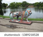 Small photo of OSHKOSH, WISCONSIN / USA - September 20, 2013: "Pride of Oshkosh" sculpture, "A Peaceable Kingdom," by William Greider, on display at the Menominee Park Zoo