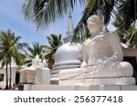 Small photo of Buddhist Stupa under palm trees on Nainativu island near Jaffna in Indian Ocean, Sri Lanka, erected by Sri Lankan army after capitulation of Tamil Tigers