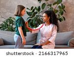 Small photo of Auscultation Heart and Lungs Exam with Stethoscope. Child Girl Visiting Doctor for regular checkup. African American Female Pediatrician in Pediatric Medical Office with Young Female Patient