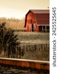 A rustic red barn in the...