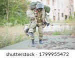 A military man carries his...