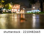 Night urban landscape, colored lights reflected in the wet asphalt in fall. Rainy night street in the city.
The lights of a rainy night in the autumn city of disfocus and bokeh. Neon street illuminati