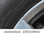 Small photo of Chipped alloy wheels. Chipped abrasion of silver alloy wheels around the edge of the wheel. Repair of car wheels. Wheel truck is abrasion damage.