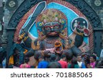 Small photo of Kathmandu, Nepal - April 16 2016: Nepalese people praying to the huge stone image of Bhairav represents deity Shiva, it was used by the government as a place for people to swear the truth.