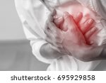 Man clutching his chest from acute pain.Heart attack symptom-Healthcare and medical concept.