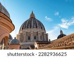 Detailed close up view on Michelangelos Dome of St Peter Basilica in Vatican City, Rome, Lazio, Europe, EU. Architectural masterpiece of Papal Basilica of Saint Peter. Church sightseeing on sunny day