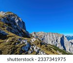 Panoramic view on the mountain peaks of the Hochschwab Region in Upper Styria, Austria. Massiv sharp and high rock wall in the Alps in Europe. Climbing tourism, wilderness. Concept freedom. Limestone