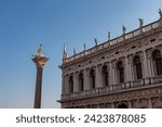 Small photo of Venice, Italy: 6 12 2022: Scenic view of Statue of Saint Teodoro of Amaseat in Venice, Veneto, Northern Italy, Europe. Monumental balustrade with statues of Saint Mark Library designed renaissance