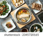 Small photo of Korean traditional food, various side dishes and abalone pot rice