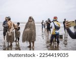 Small photo of A Malaysian indigenous Mah Meri tribesman wears a traditionally crafted mask as he dances during the "Puja Pantai" ritual, in Carey Island on the outskirts of Kuala Lumpur on January 26, 2023.